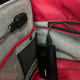 The passthrough USB port in action. Normally, the battery pack would live inside that back pocket.